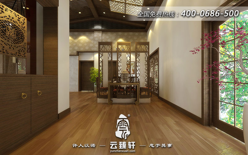 玄關(guān)選擇嚴謹風(fēng)格的案幾,案幾上擺放的佛像頭像